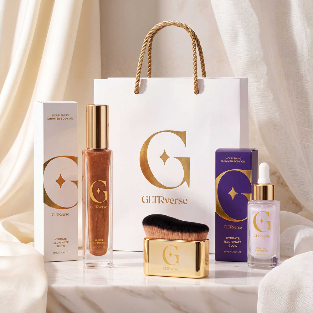 GLTRverse Cosmic Heat Duo set, bronze-gold Amber and pearl-violet Stardust shimmer body oils with the gold brush, boxes and gift bag